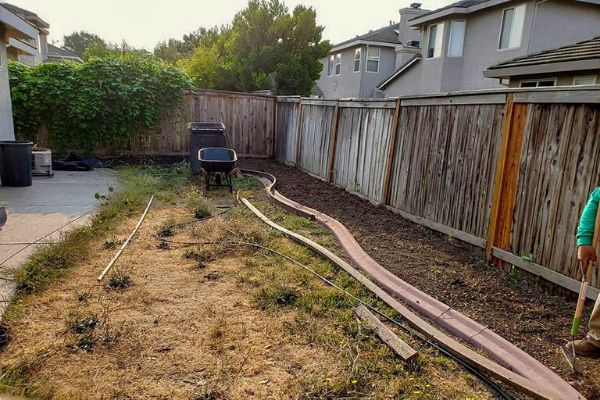  Backyard getting a sprinkler system put in place